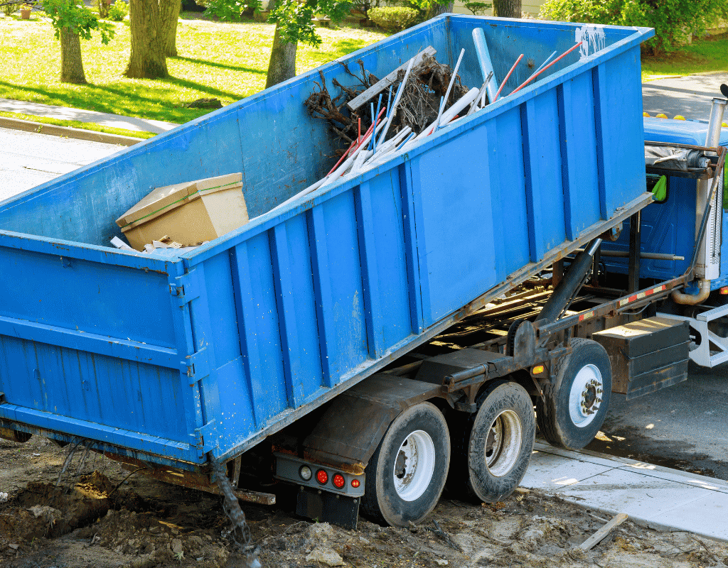 blue roll off dumpster container delivered to residential job site